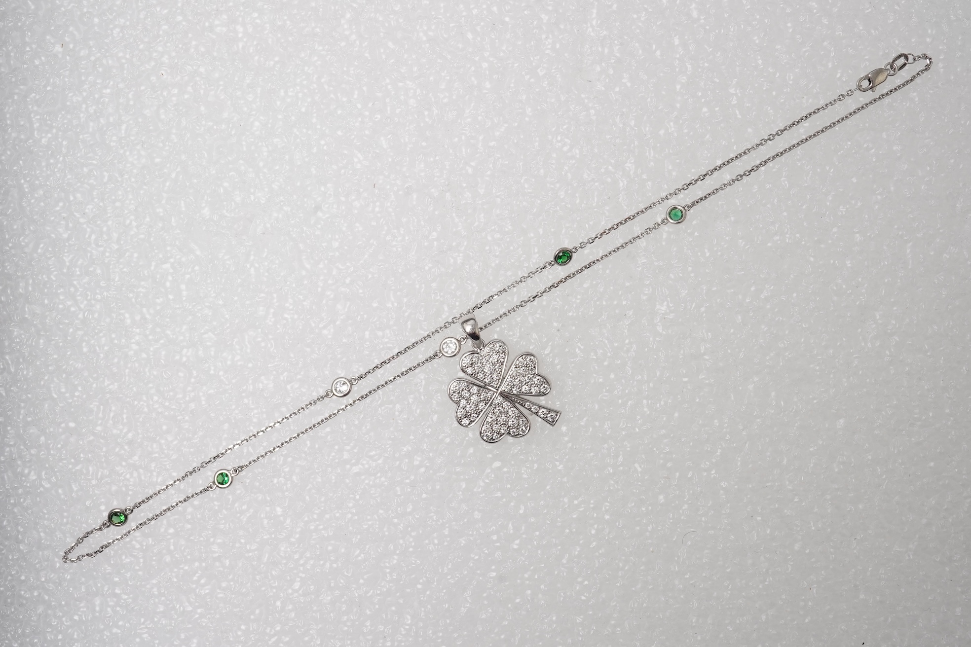 A diamond and tsavorite pendant necklace
